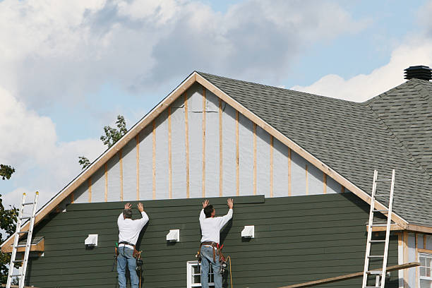 Professional Storm Damage Siding Repair technician working in Greens Fork, IN